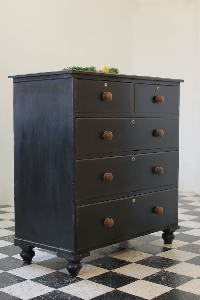 large victorian pine painted black chest with five graduating drawers, contrasting brown knobs & turned feet, very solid and heavy.