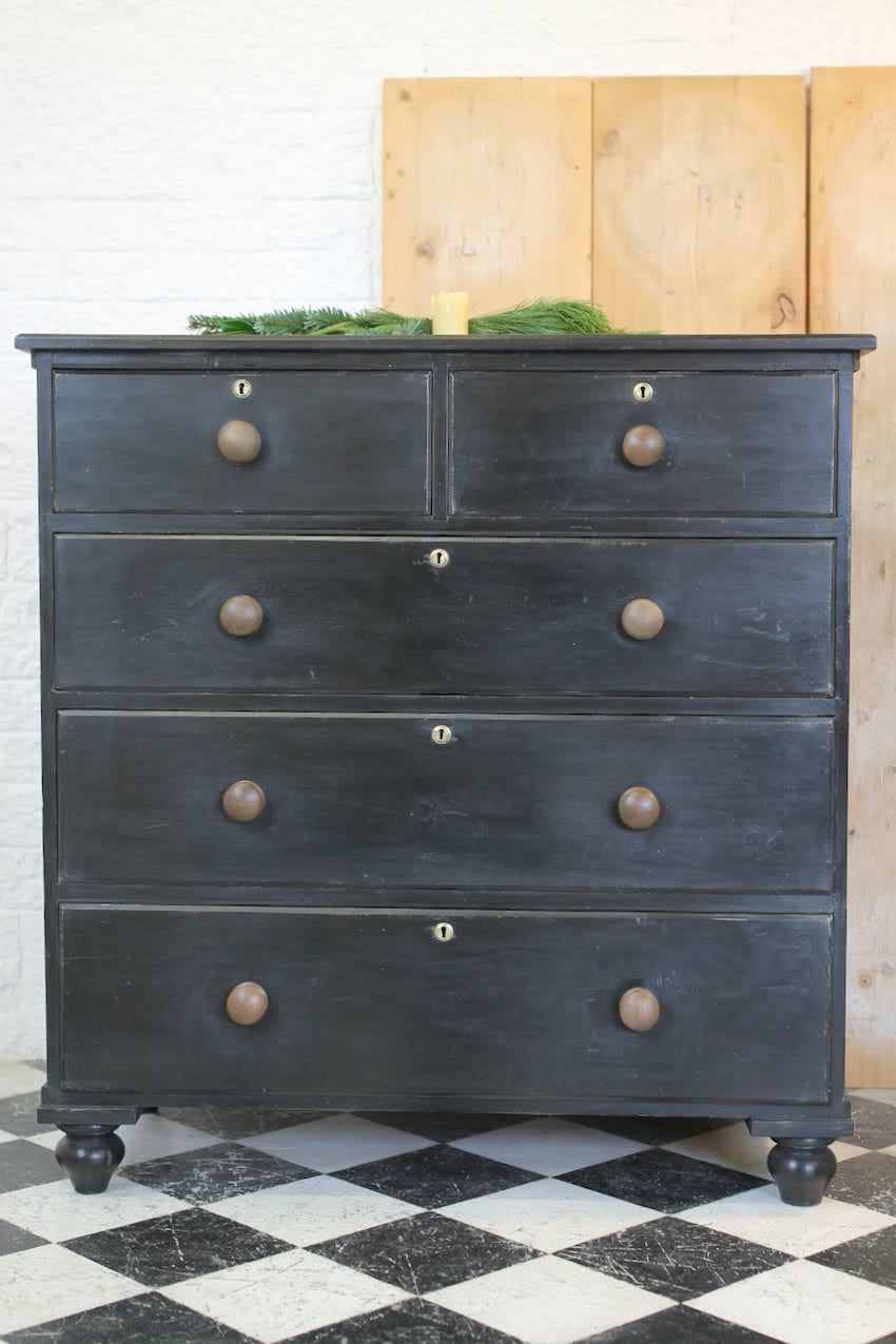 large victorian pine painted black chest with five graduating drawers, contrasting brown knobs & turned feet, very solid and heavy.