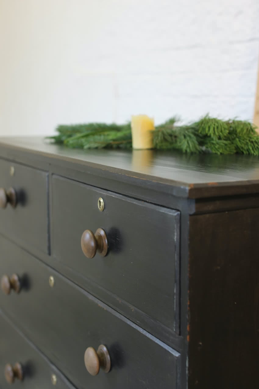 large victorian pine painted black chest with five graduating drawers, contrasting brown knobs & turned feet, very solid and heavy.