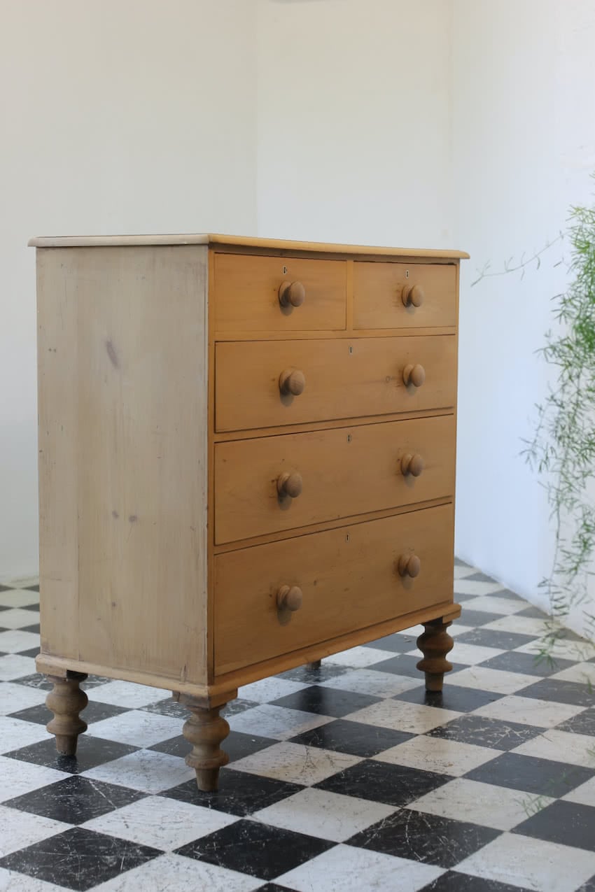gorgeous looking antique english pine chest with new knobs and original feet, a very solid large chest of drawers.
