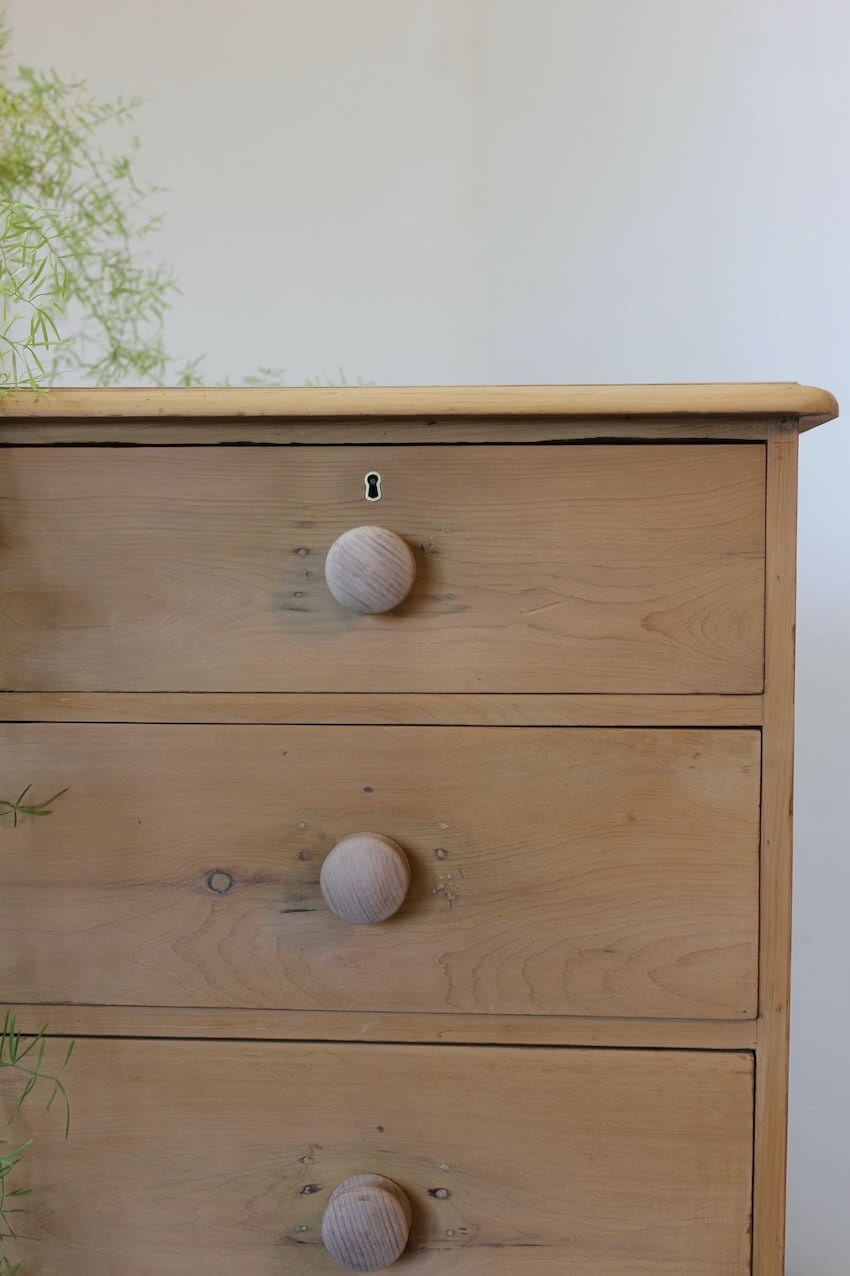 gorgeous looking antique english pine chest with new knobs and original feet, a very solid large chest of drawers.