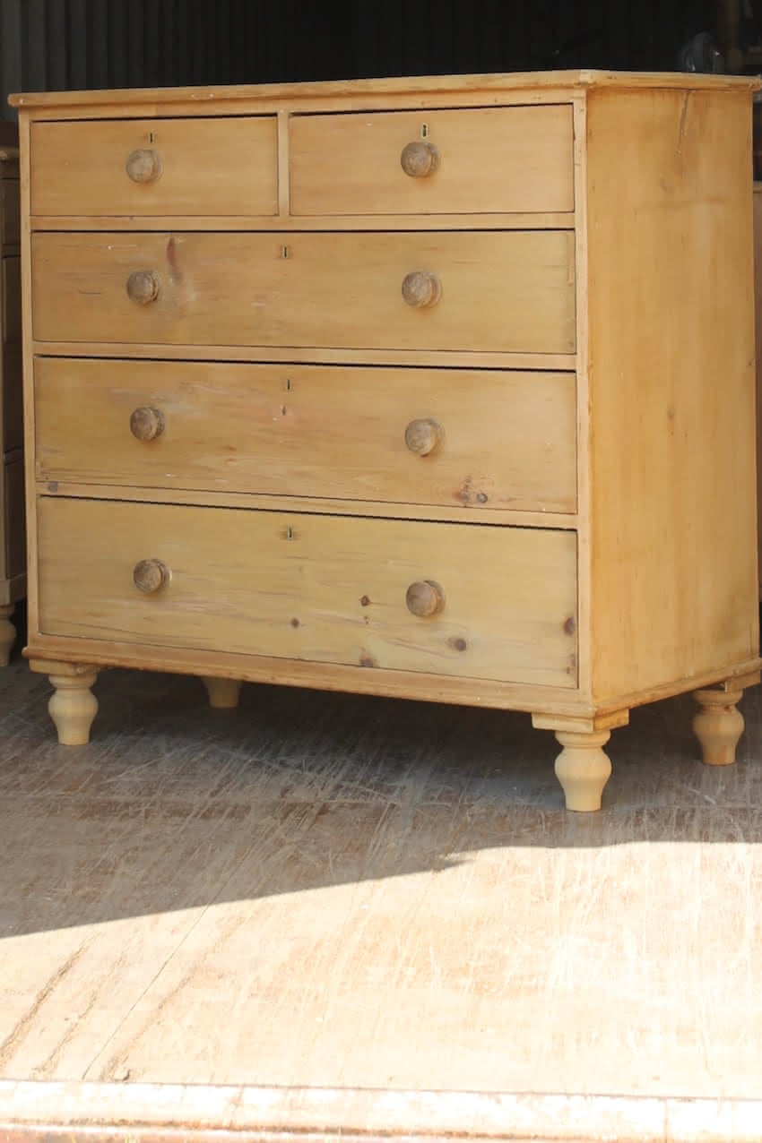 beautiful fine pine large victorian chest with five graduating drawers, very clean condition with wooden knobs & new turned feet.