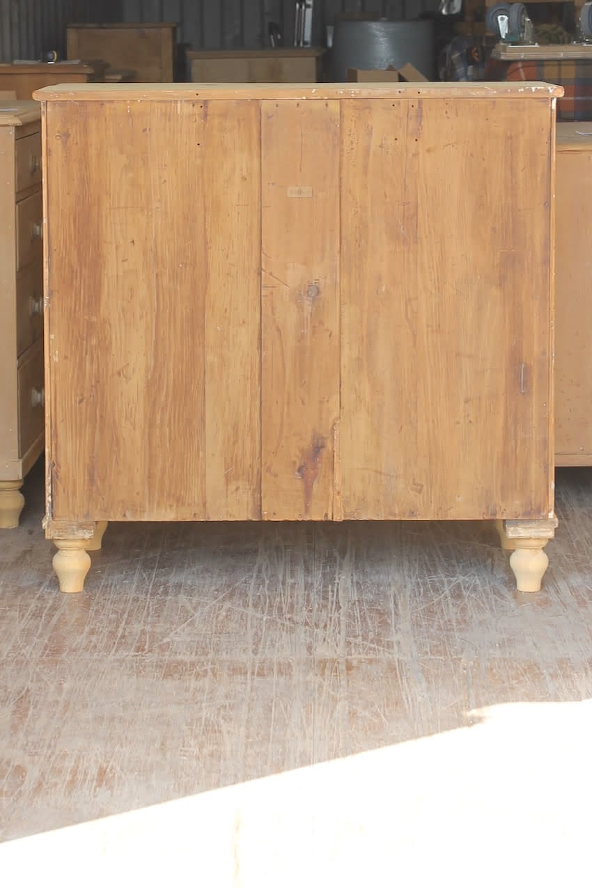 beautiful fine pine large victorian chest with five graduating drawers, very clean condition with wooden knobs & new turned feet.