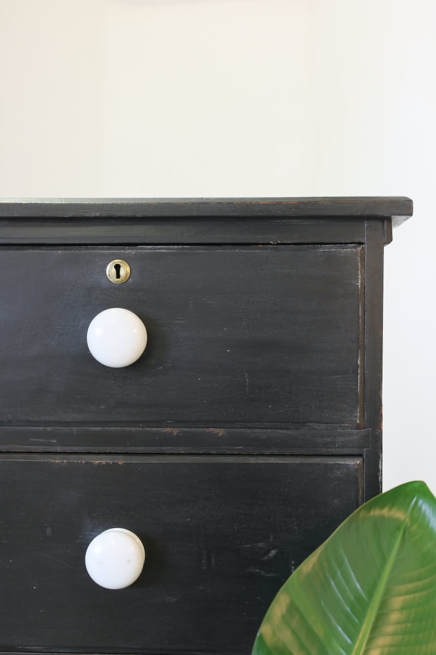 gorgeous large victorian pine painted black chest with five graduating drawers, original ceramic knobs & turned feet, very solid and heavy.