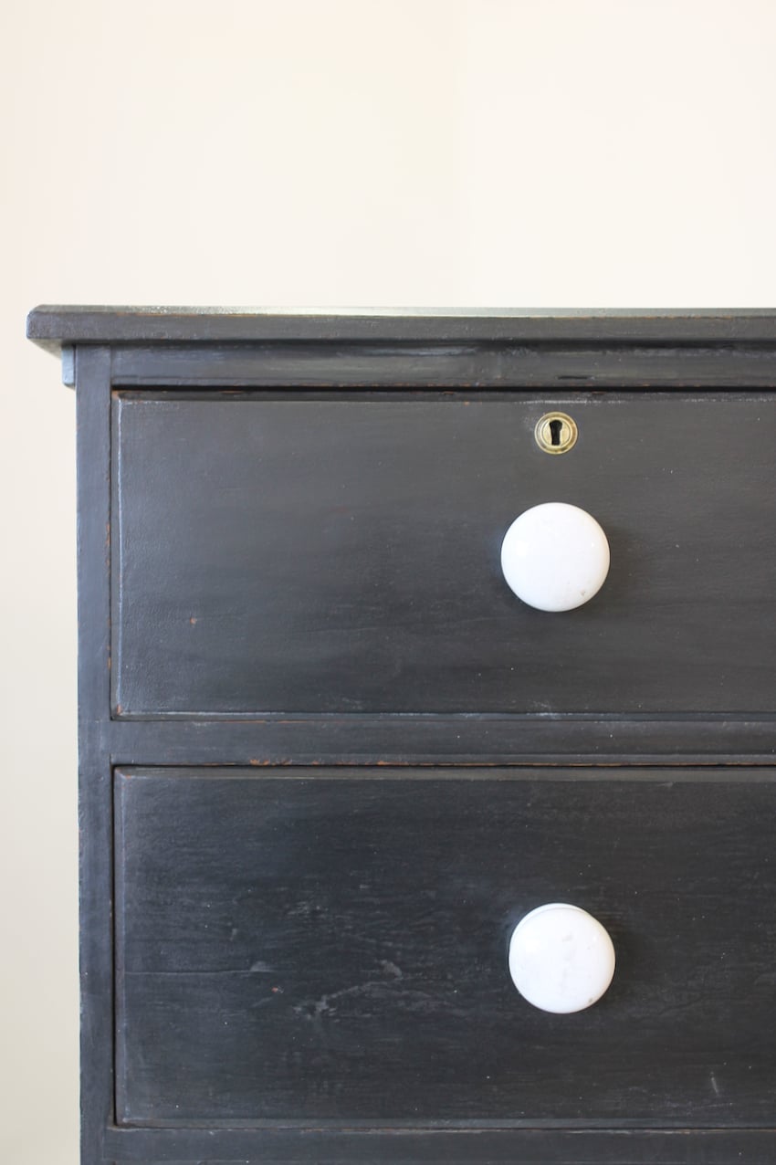 gorgeous large victorian pine painted black chest with five graduating drawers, original ceramic knobs & turned feet, very solid and heavy.