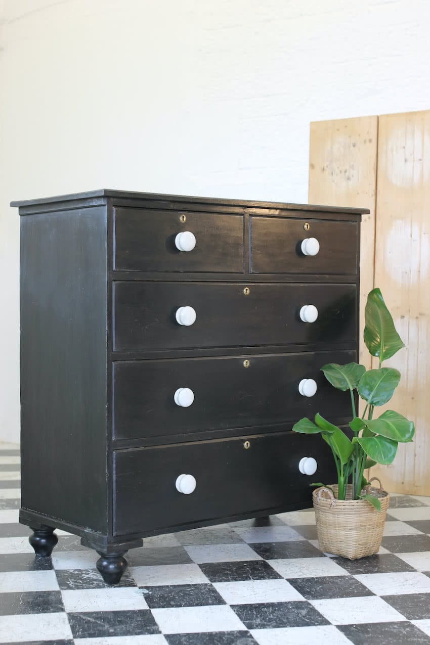 gorgeous large victorian pine painted black chest with five graduating drawers, original ceramic knobs & turned feet, very solid and heavy.