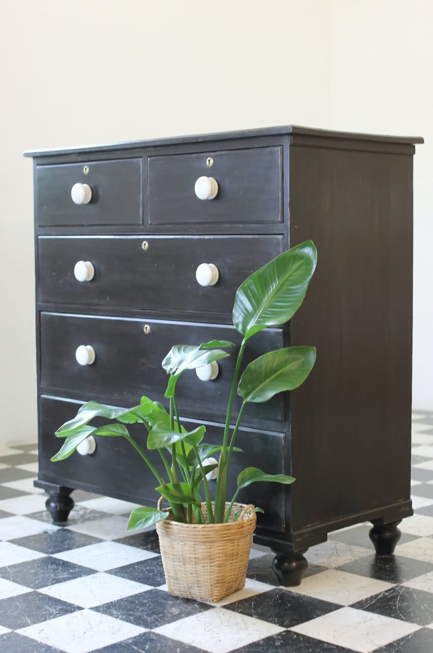 gorgeous large victorian pine painted black chest with five graduating drawers, original ceramic knobs & turned feet, very solid and heavy.