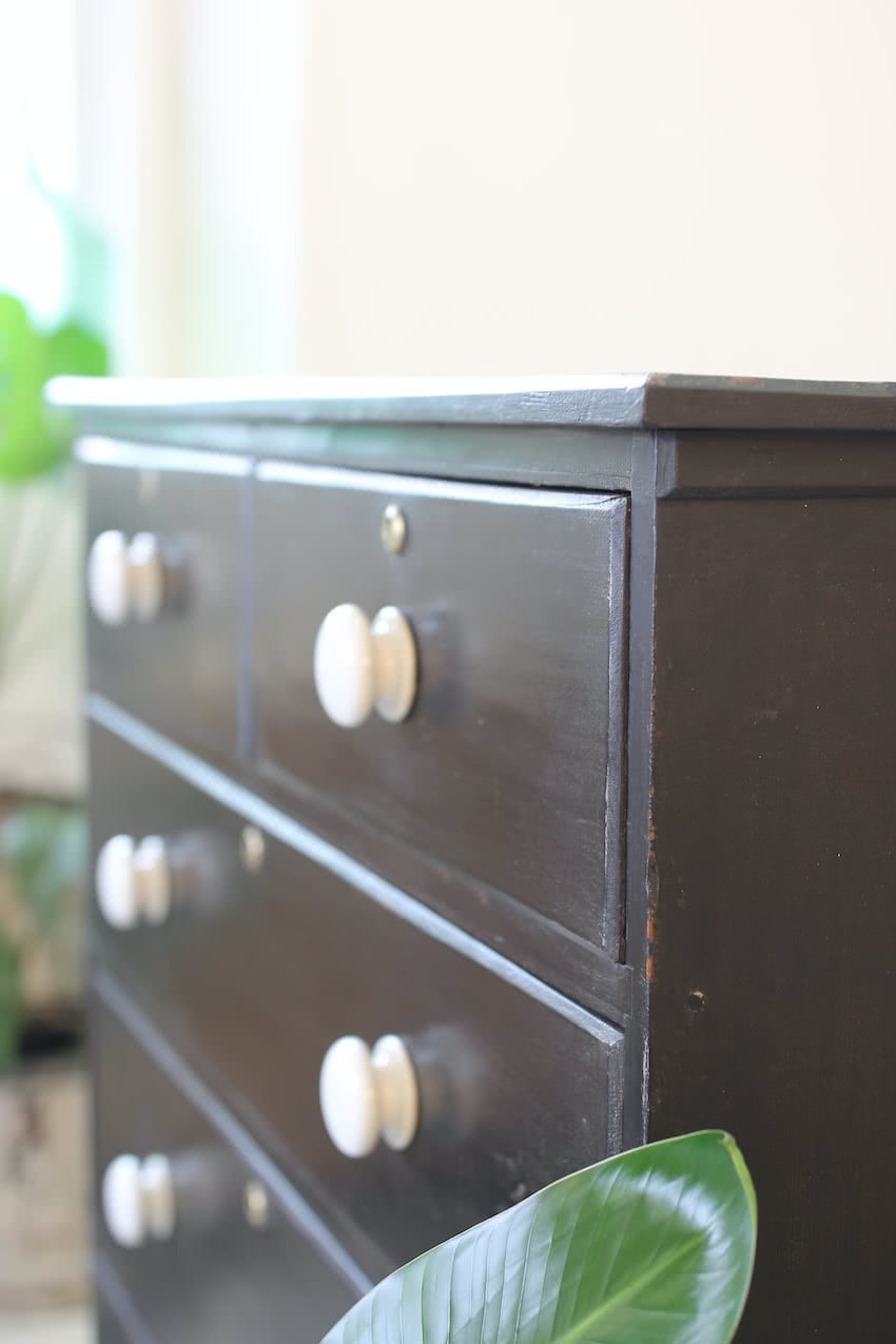 gorgeous large victorian pine painted black chest with five graduating drawers, original ceramic knobs & turned feet, very solid and heavy.