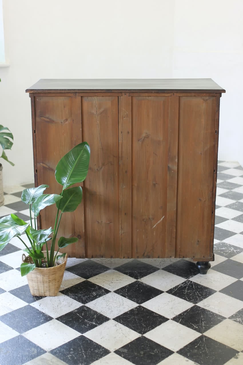 gorgeous large victorian pine painted black chest with five graduating drawers, original ceramic knobs & turned feet, very solid and heavy.