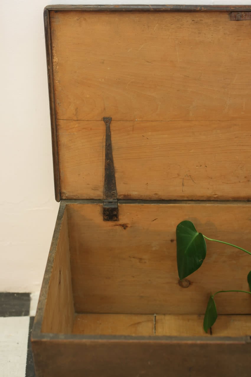restored english pine blanket box with original paint and patina, original ironwork hinges, handles & working lock and key.