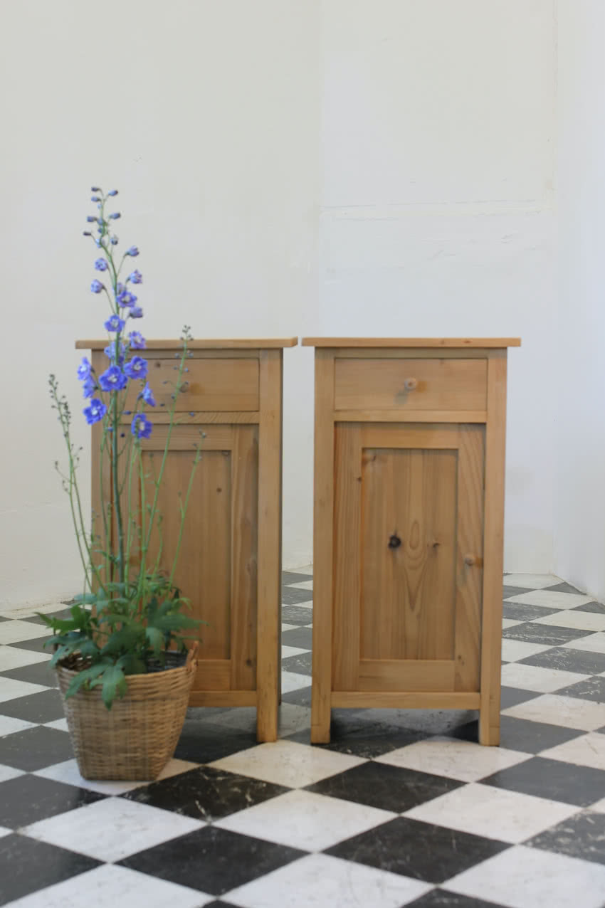 matching pair of restored pine bedside cupboards with drawer and small shelf inside & left in the dry natural finish.