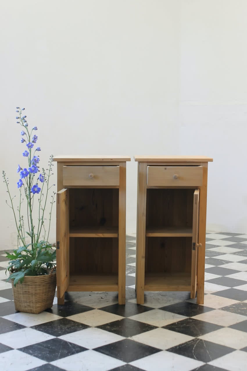 matching pair of restored pine bedside cupboards with drawer and small shelf inside & left in the dry natural finish.