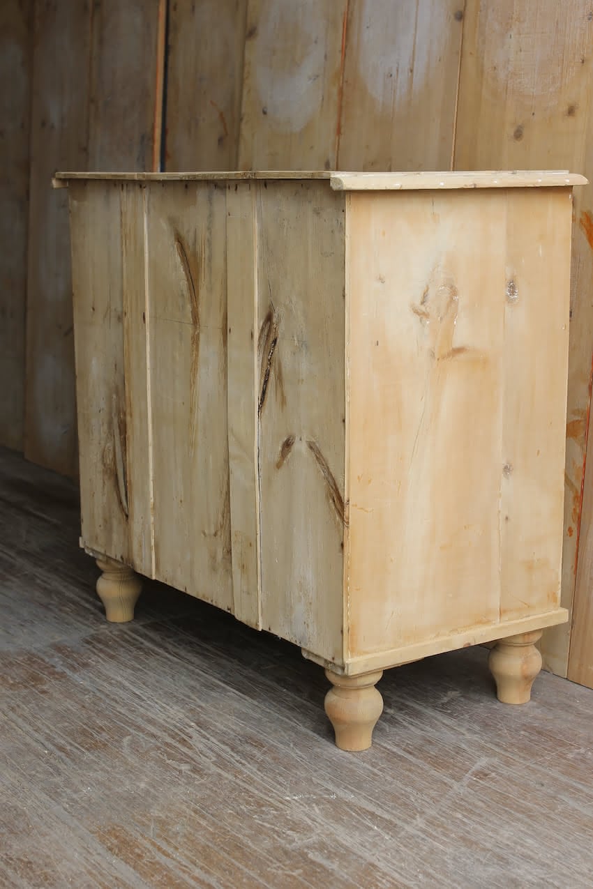 gorgeous very clean english pine cupboard two door base with one long original shelf inside and two brass round knobs.