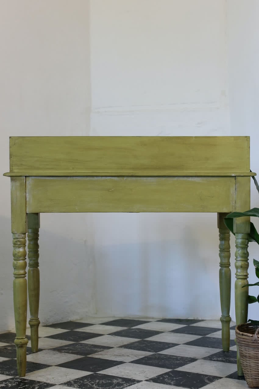 very pretty pine english galleried two drawer side table with brass handles, painted a shade of Lichen with a slight distressed finish.