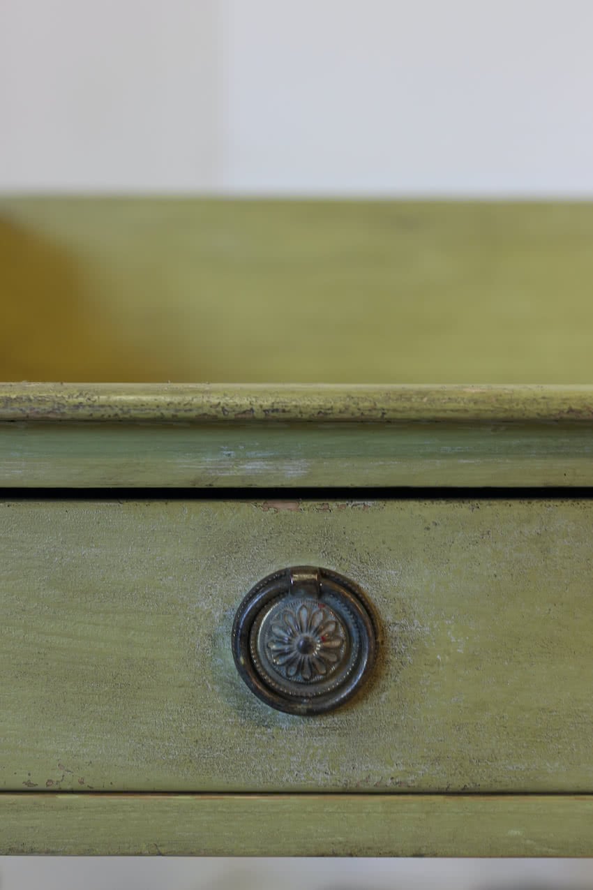 very pretty pine english galleried two drawer side table with brass handles, painted a shade of Lichen with a slight distressed finish.