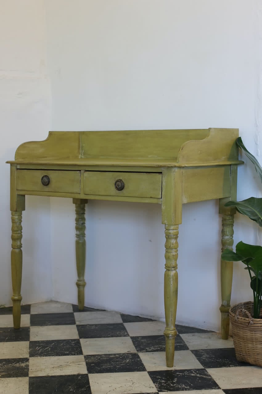 very pretty pine english galleried two drawer side table with brass handles, painted a shade of Lichen with a slight distressed finish.