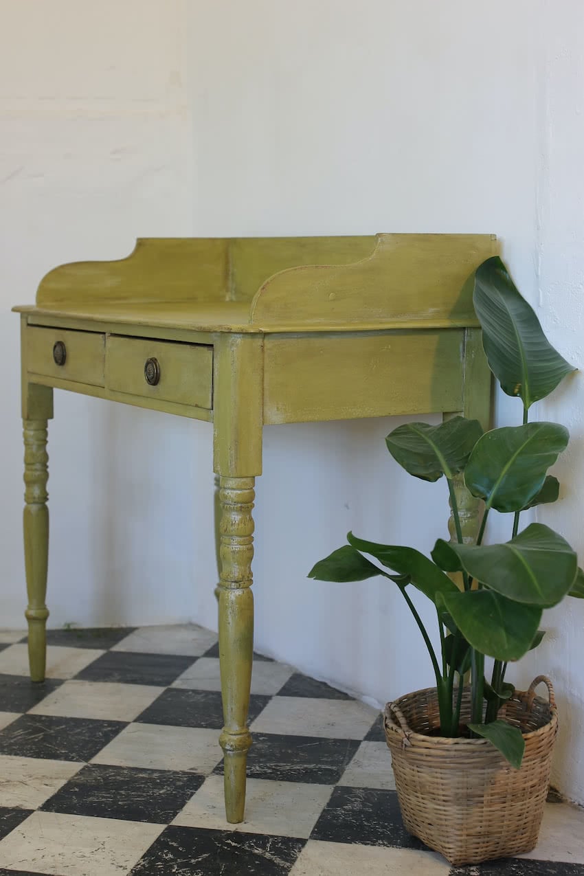 very pretty pine english galleried two drawer side table with brass handles, painted a shade of Lichen with a slight distressed finish.