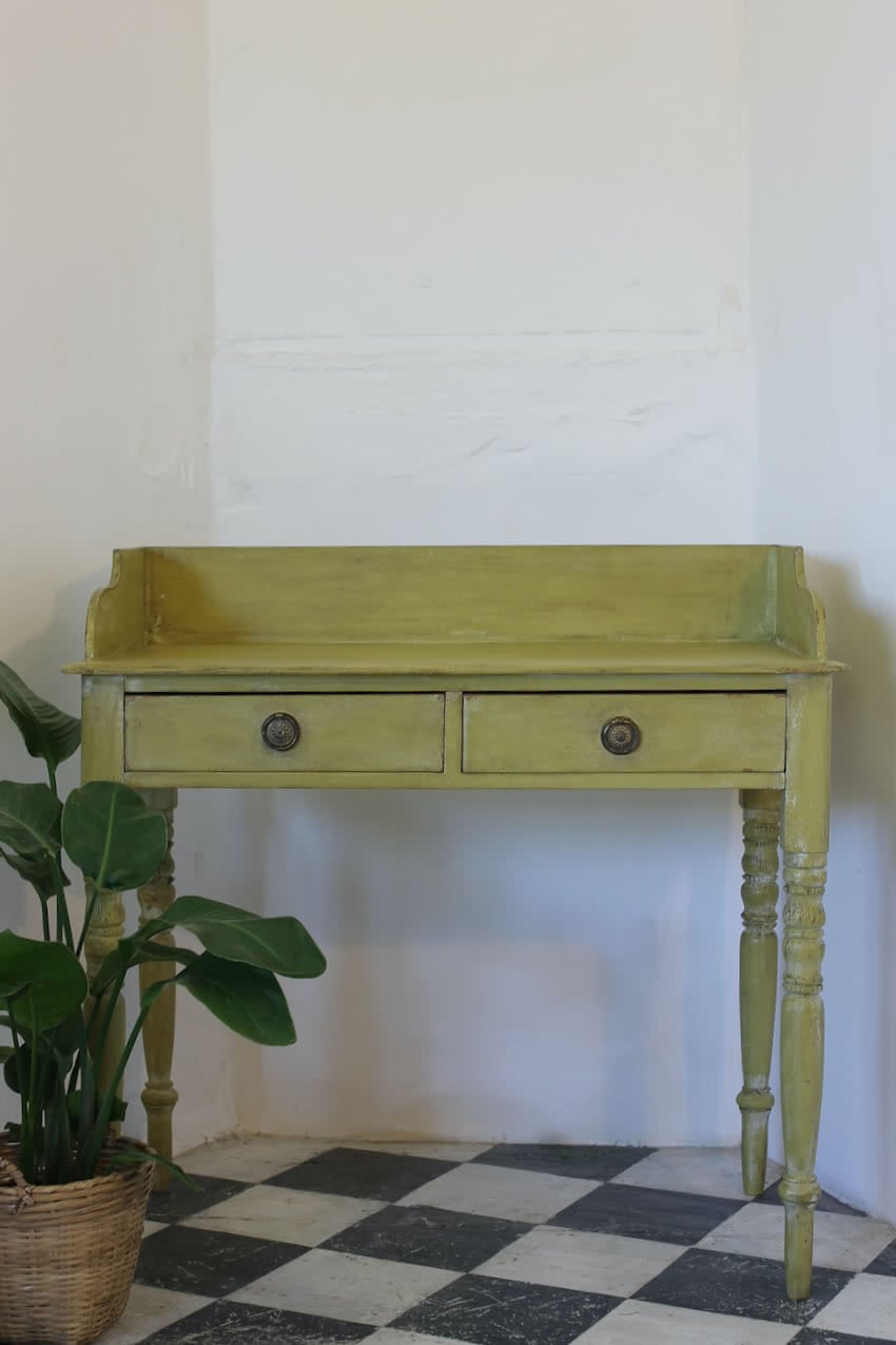 very pretty pine english galleried two drawer side table with brass handles, painted a shade of Lichen with a slight distressed finish.