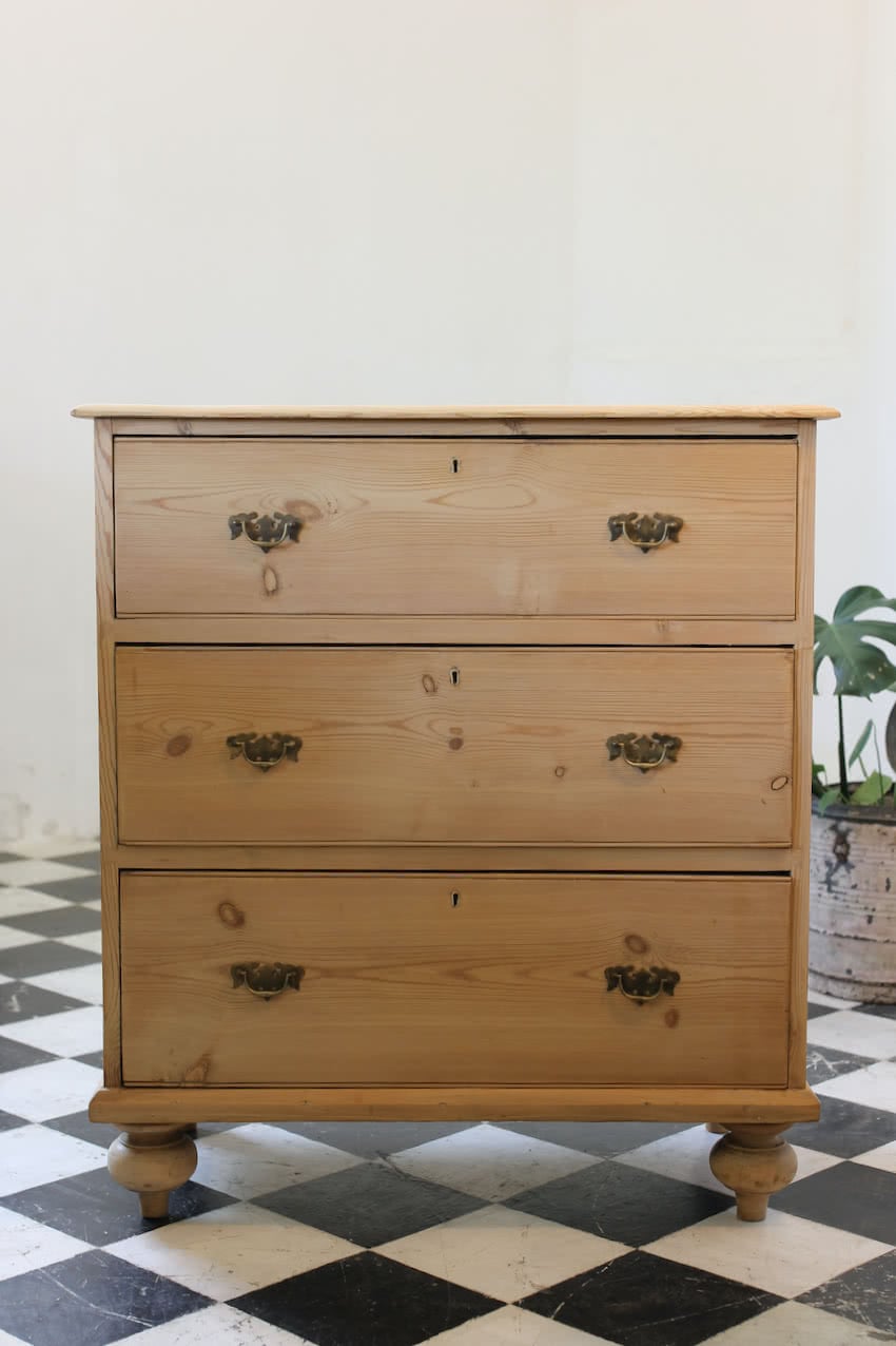 very pretty restored pine large three drawer chest, with a bleached look, beautiful turned feet & brass swan neck handles.