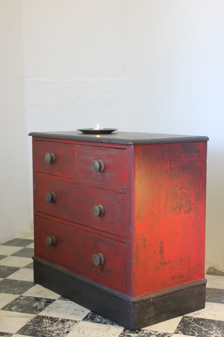 victorian antique pine restored chest with original red paint, turned wooden knobs & the chest sits on repainted black plinth.