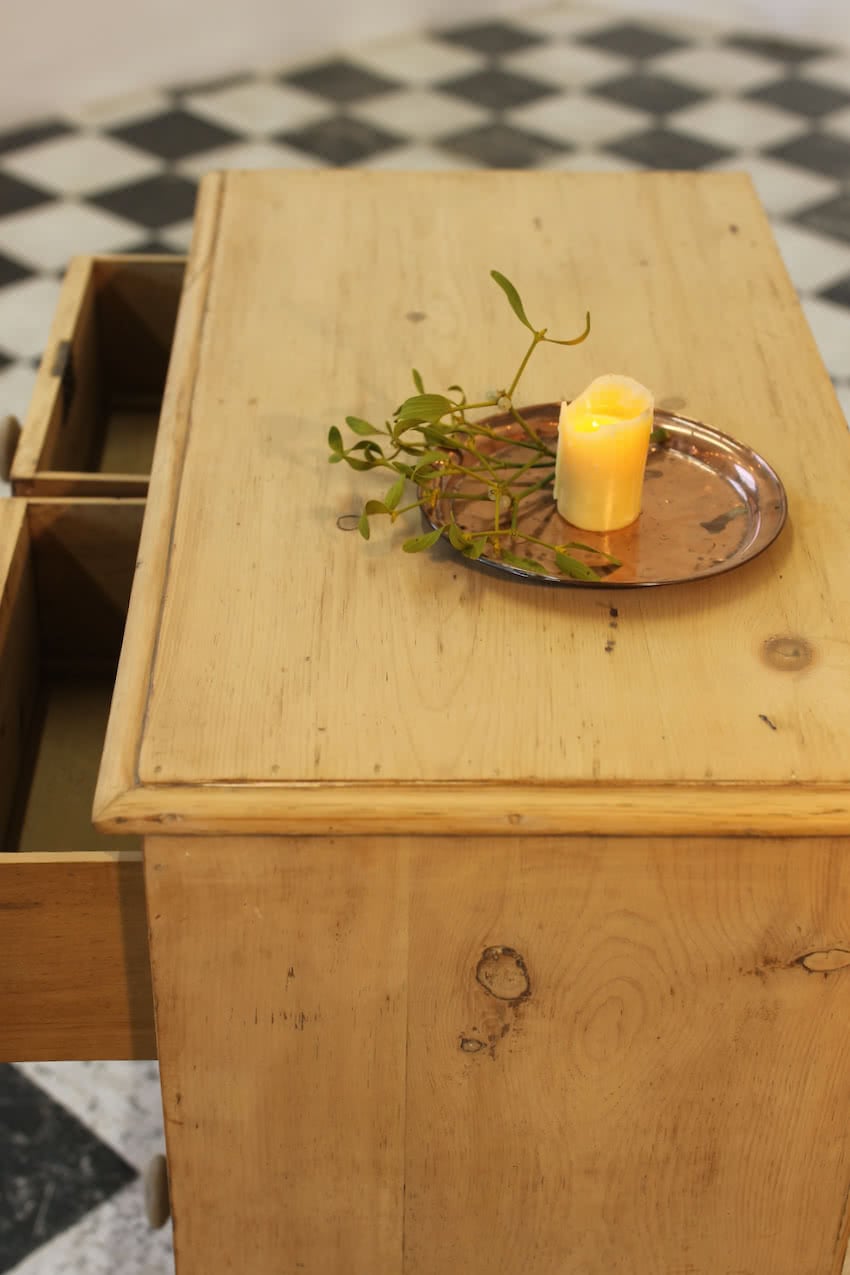 victorian restored rustic looking pine chest with four graduating drawers, wooden knobs and a deep plinth.