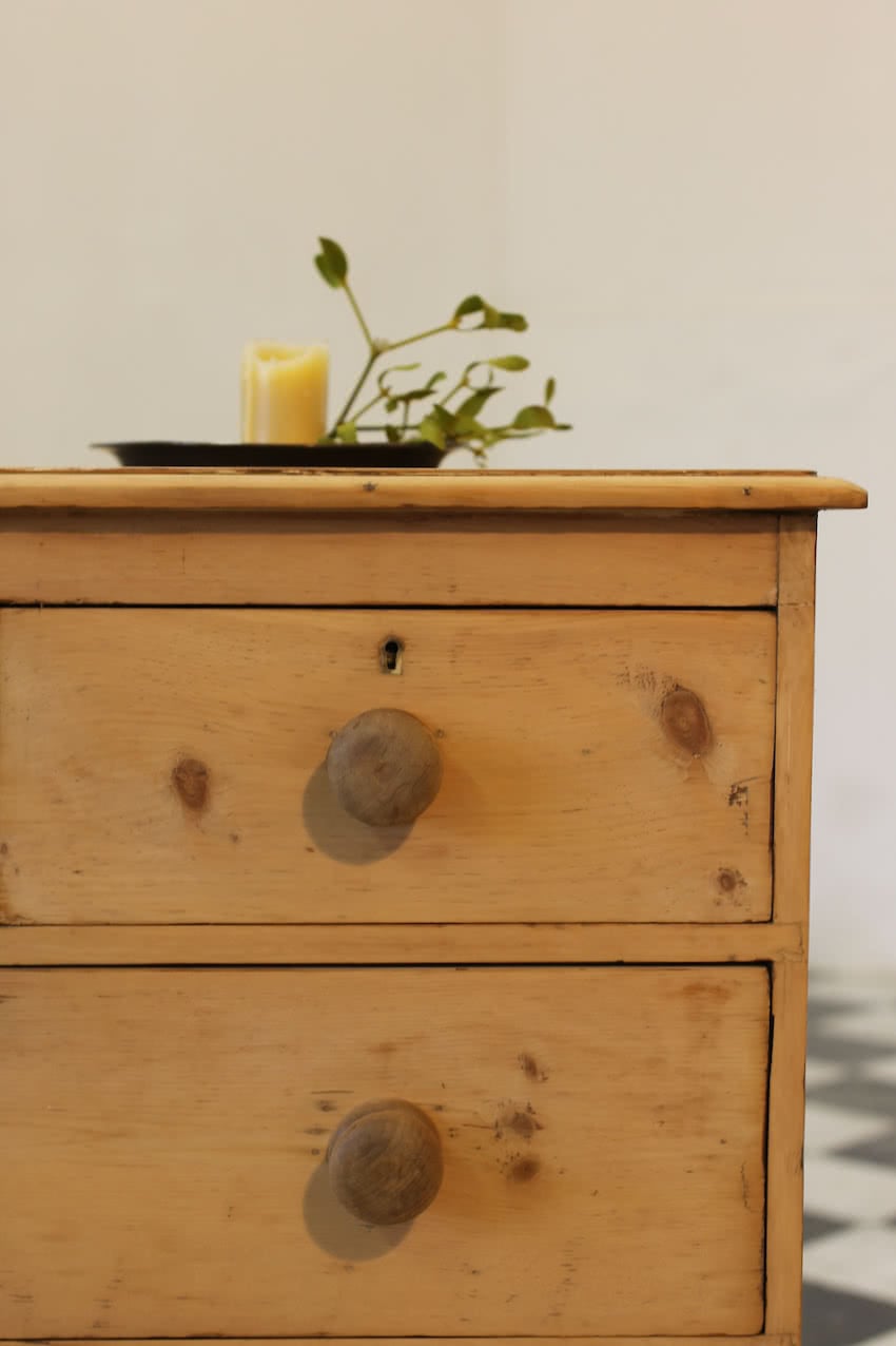 victorian restored rustic looking pine chest with four graduating drawers, wooden knobs and a deep plinth.