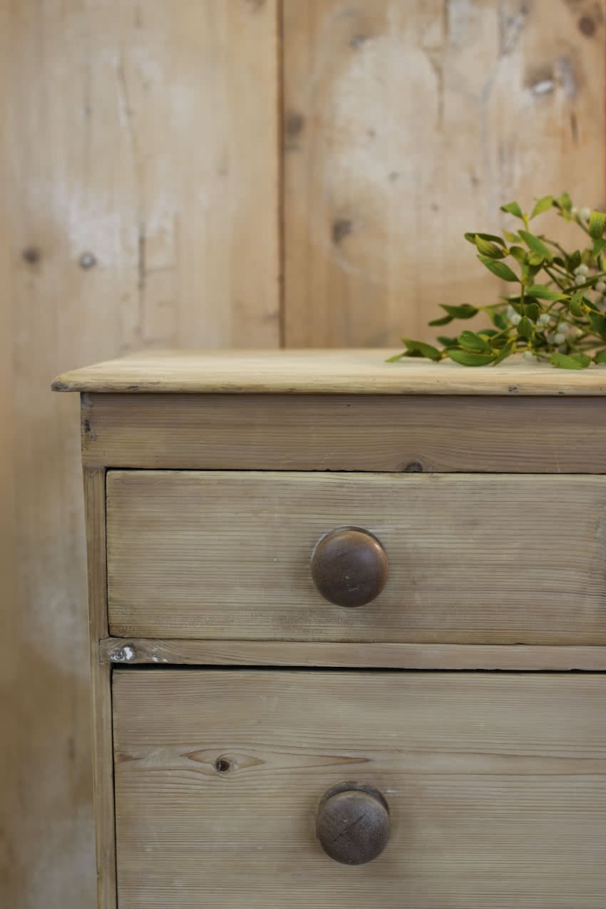 pretty rustic looking restored victorian pine chest with three graduating drawers, contrasting knobs & original turned feet.