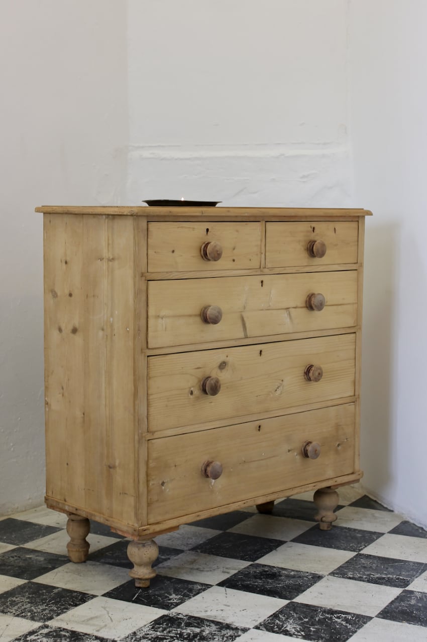 fairly rustic looking stripped pine chest victorian chest with original turned knob and feet & left with a dry finish.