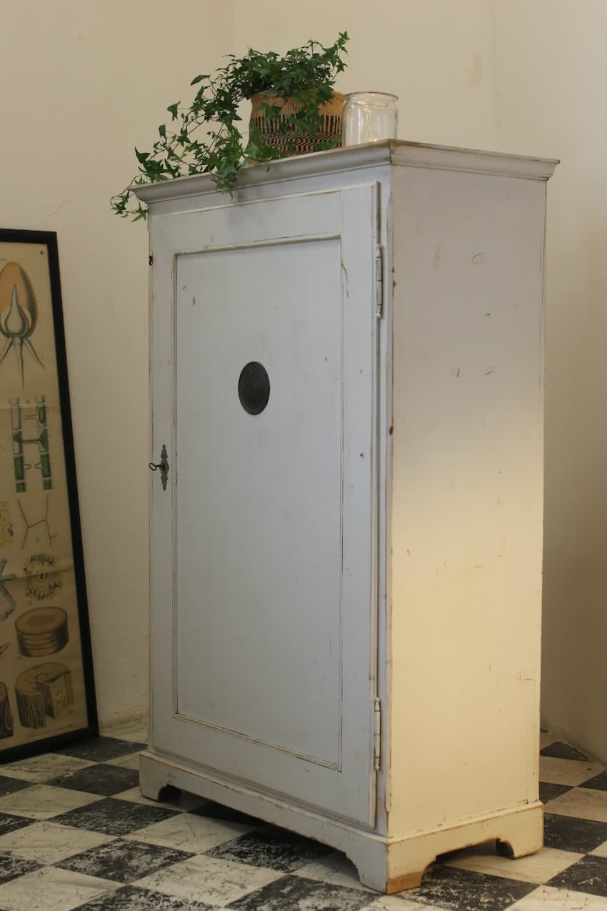 original painted very pale blue antique pine european cupboard with original shelves and drawers with small ceramic knobs.