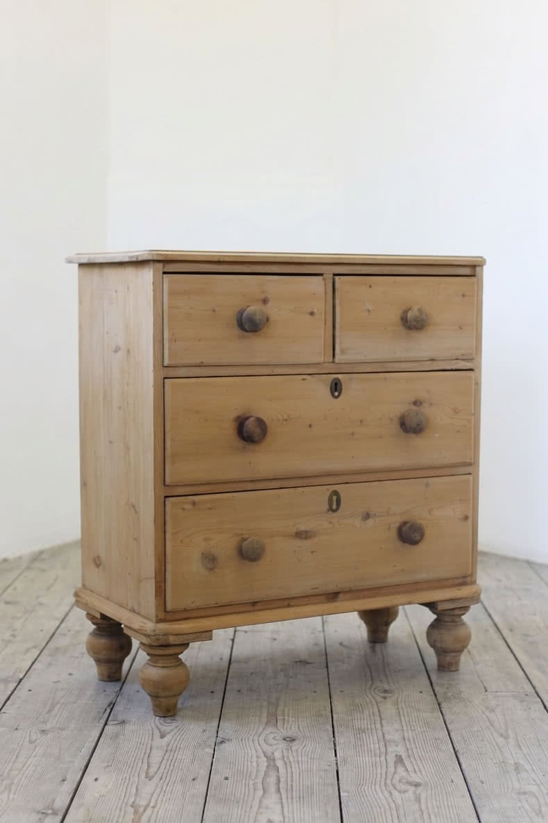 antique pine chest restored with original knobs and feet, brass keyplates added later.