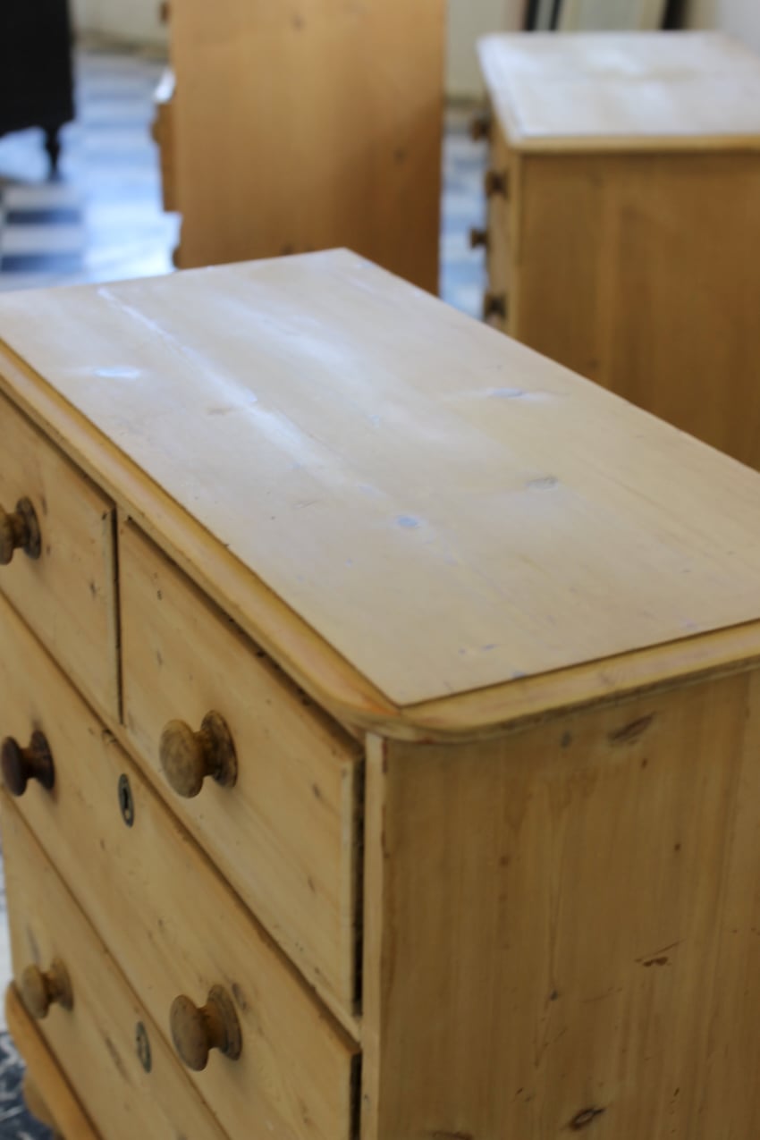 restored fine pine blonde victorian large chest of drawers with original wooden knobs and new turned tulip shaped feet.antique pine chest restored with original knobs and feet, brass keyplates added later.