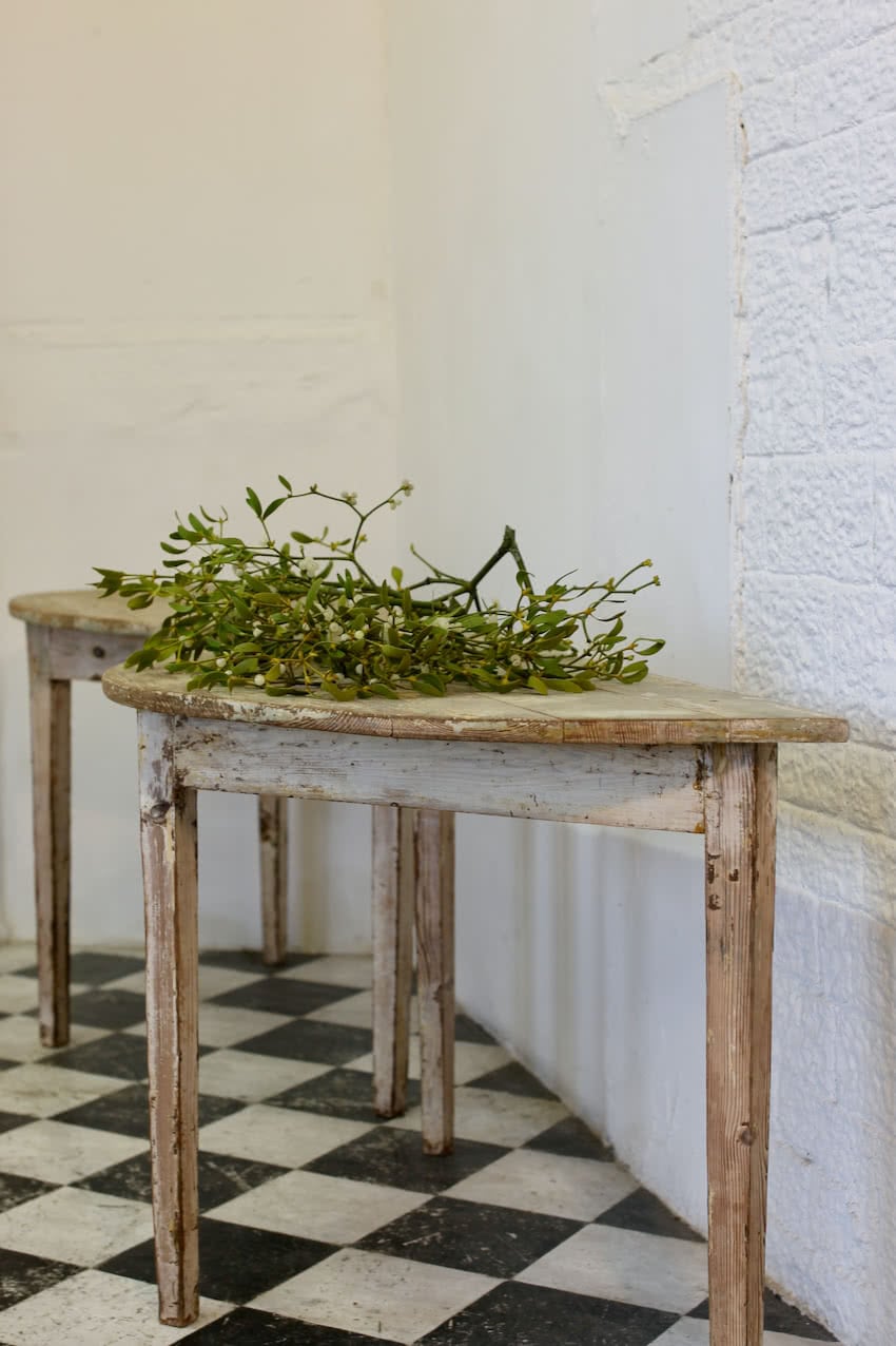 beautiful swedish pair of demi lune tables in original paint in the original condition with painted marbling effect on the top, and a repair done to a leg.