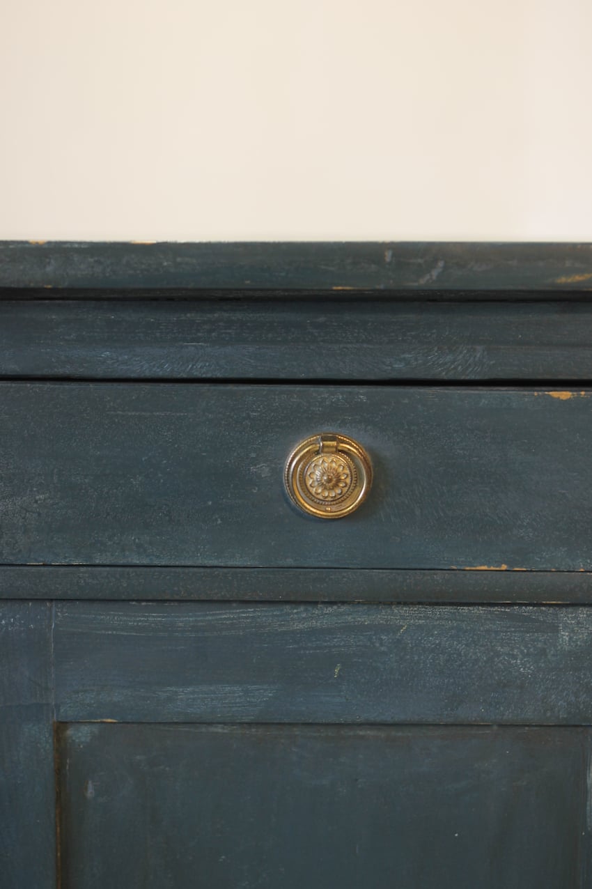 blue painted pine cupboard with two drawers with a shelf, a geometric patterned top & interior doors and drawers painted in Lichen. 