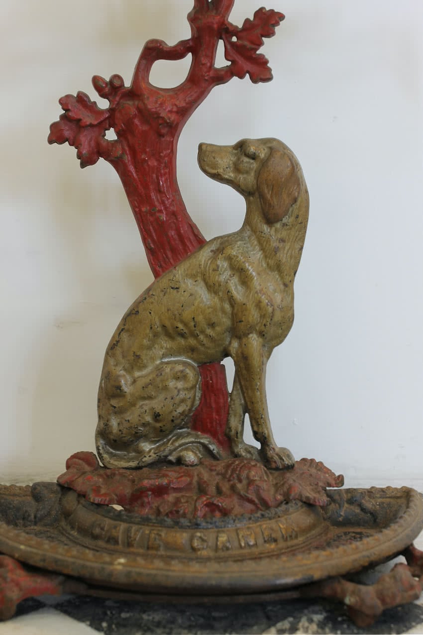 gorgeous victorian cast iron umbrella - stick stand with pretty decoration and motto ‘beware of the dog’.
