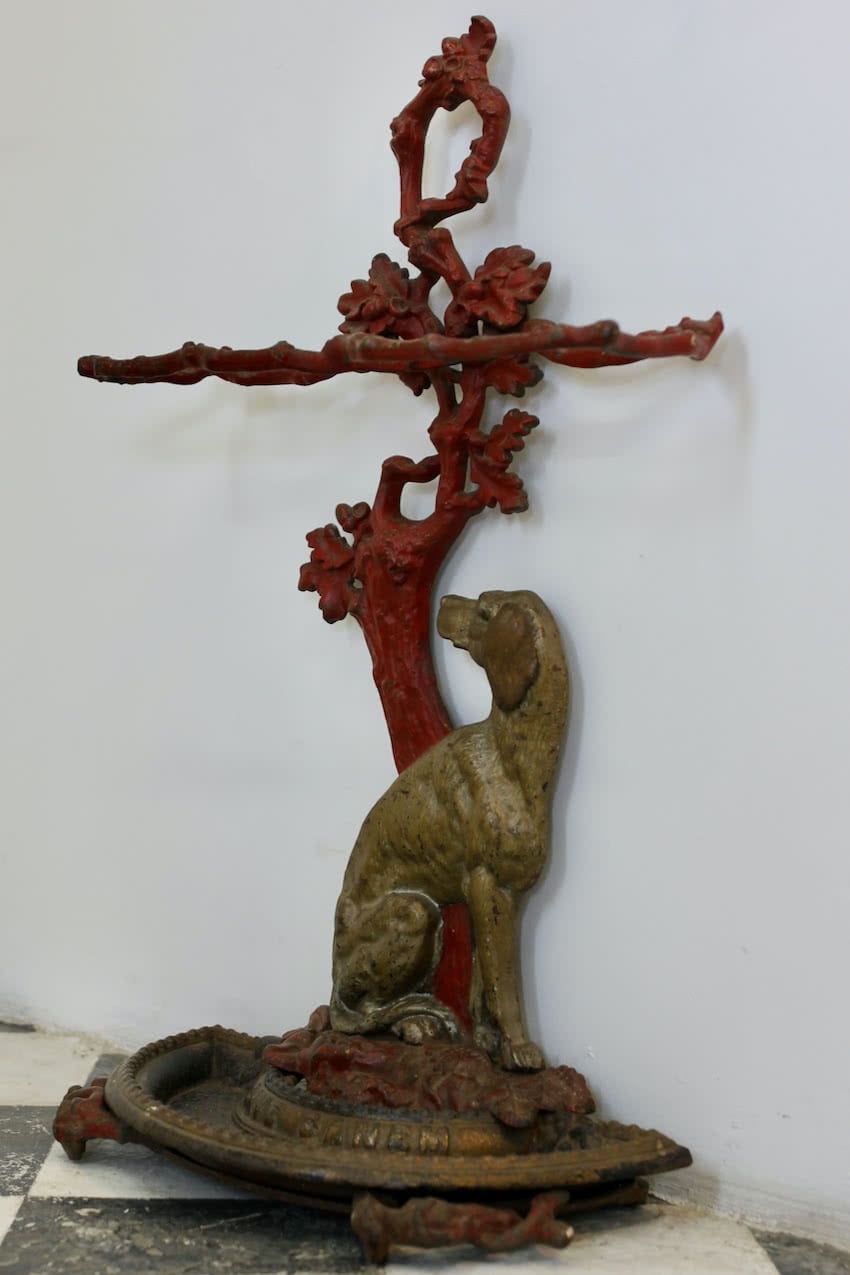gorgeous victorian cast iron umbrella - stick stand with pretty decoration and motto ‘beware of the dog’.