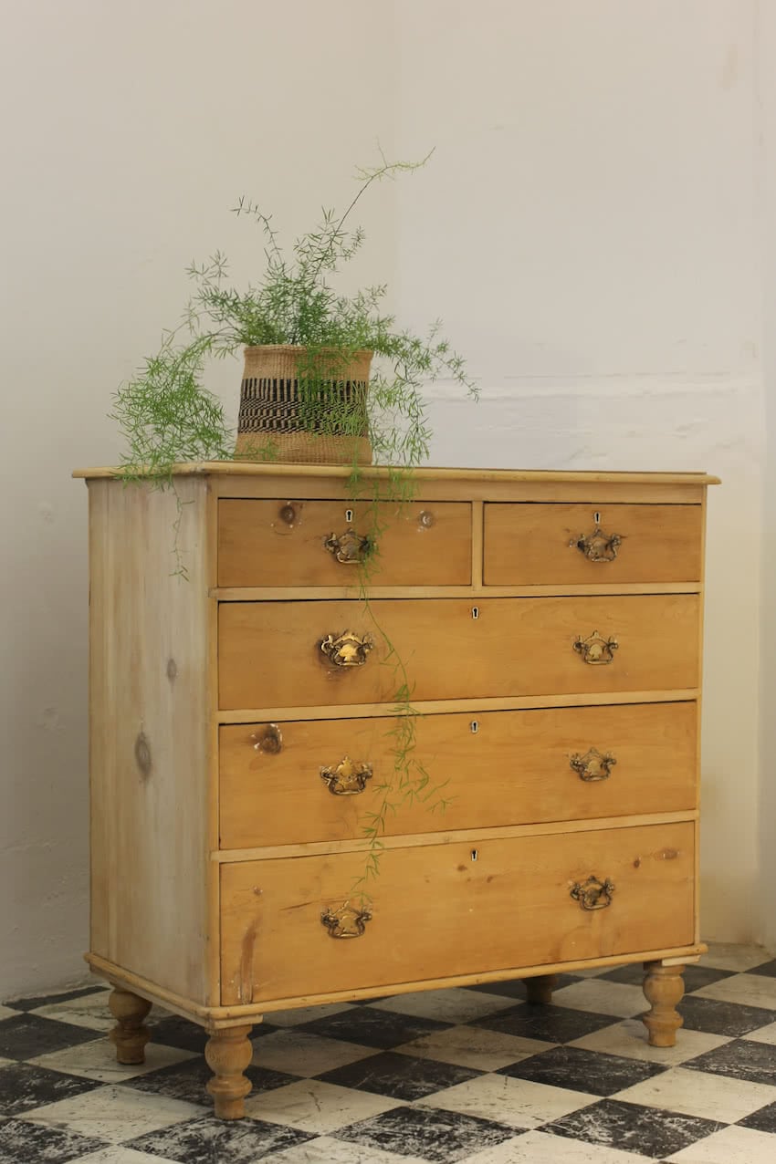 pretty victorian large chest in lovely honey coloured pine, with gentle graduating drawers, typical shaped feet and brass handles.