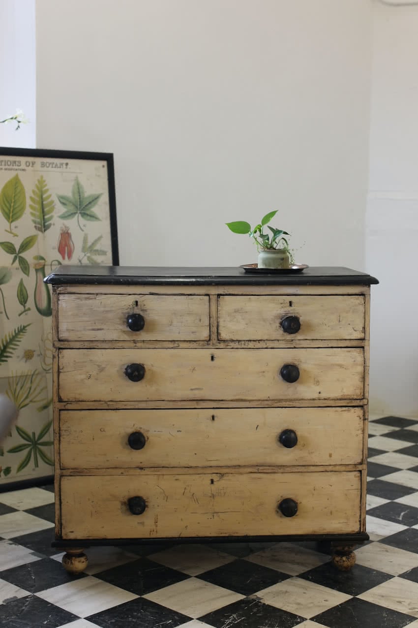 original painted victorian pine chest with original knobs and repainted black top and original turned black feet