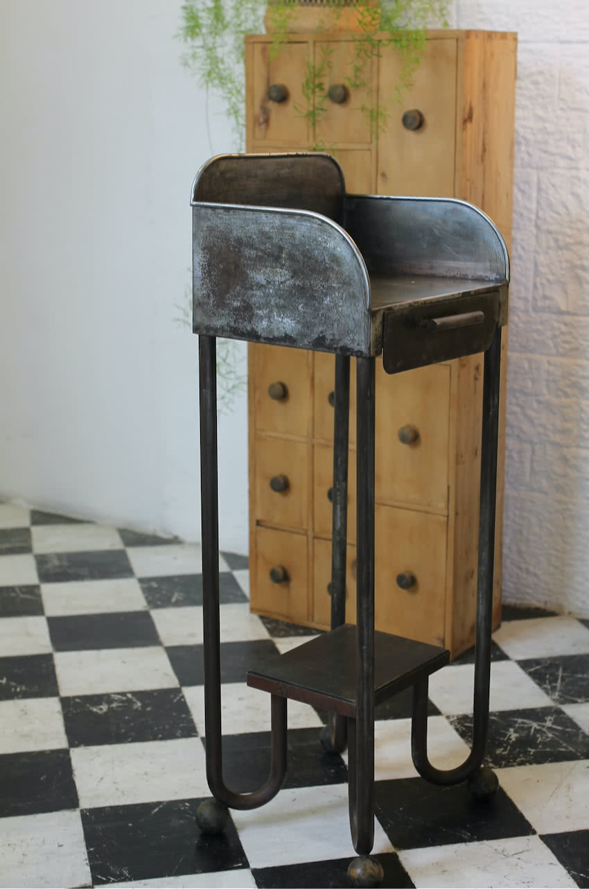 interesting vintage metal industrial medical stand with high gallery sides, a drawer with compartments & wooden ball feet.