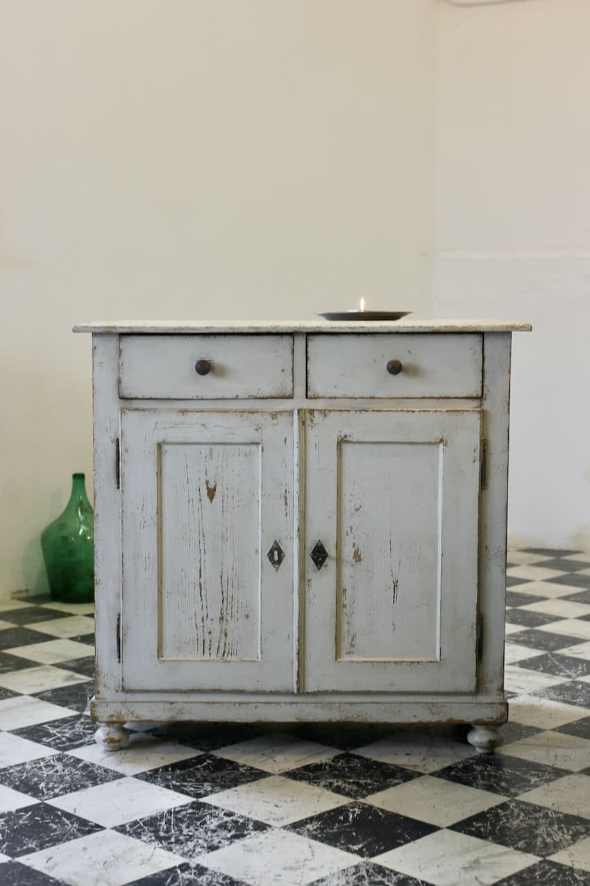gorgeous french restored painted white antique pine two drawer cupboard base with original knob & pretty turned feet with a long pine shelf inside.